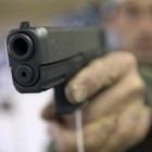 Masked Men Allegedly Bash Elderly Man in the Head with Ax Handle — but He Was Carrying Much Deadlier Method of Defense. handgun-reuters